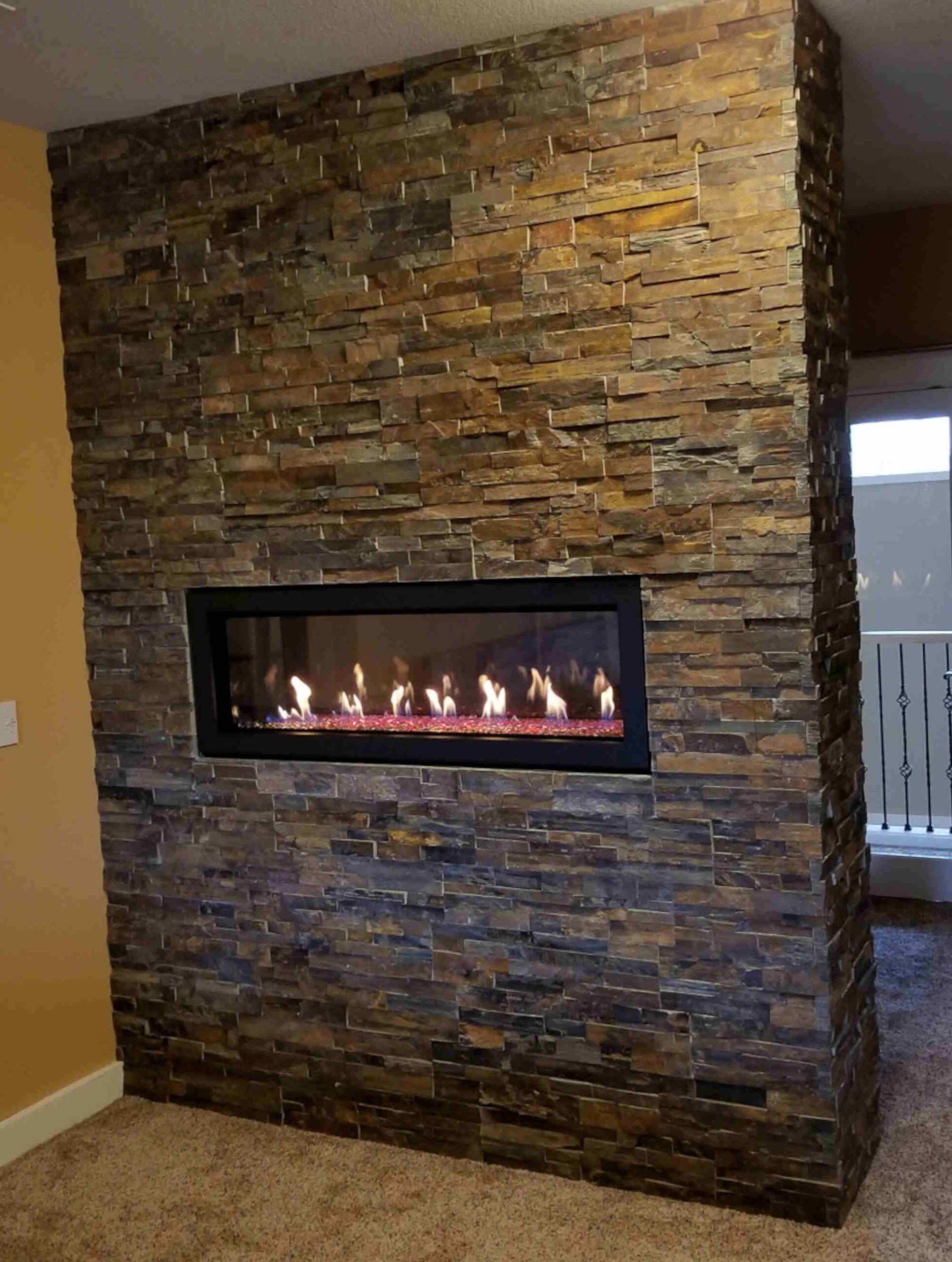 See-thru fireplace with real stone veneer